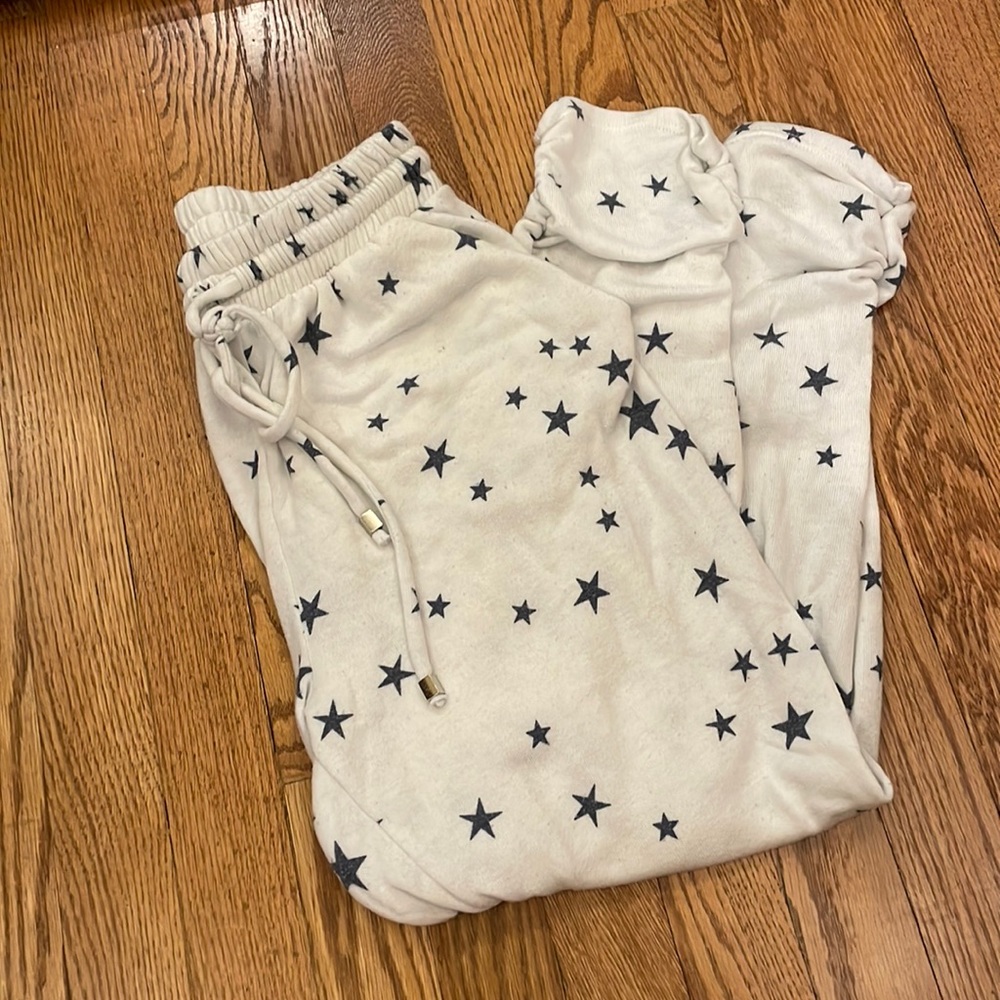 White joggers with navy blue stars